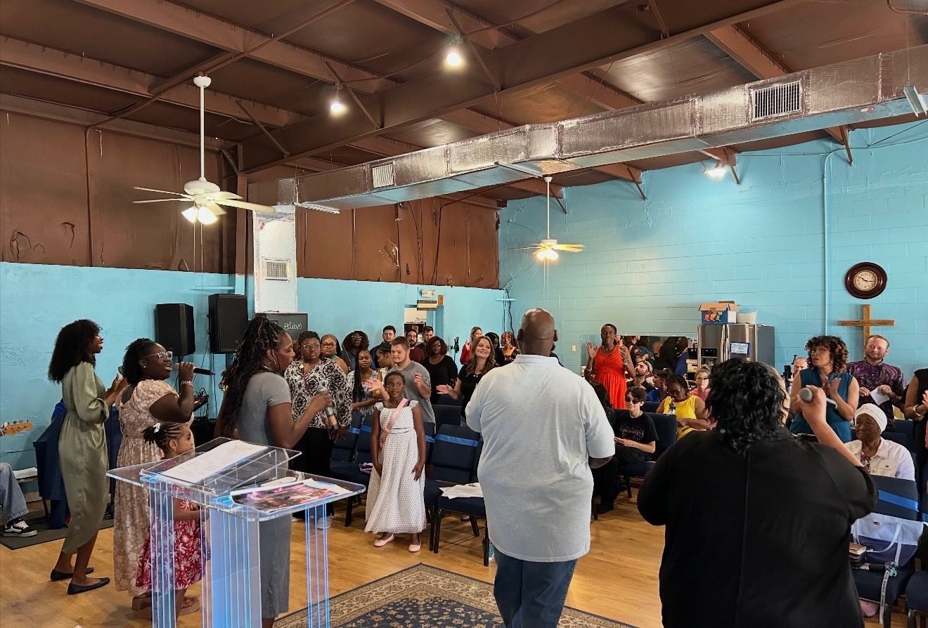 Congregation worshiping at Center of Deliverance